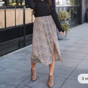 NWOT Cheetah skirt with button slit! Super stretchy and comfy!